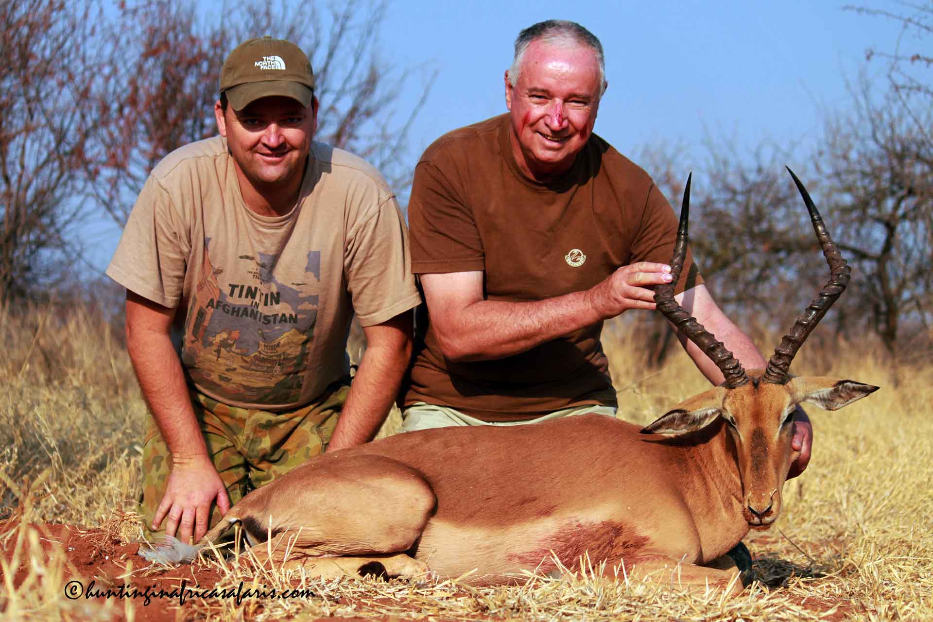 Best impala hunting in South Africa A father and son posing with a trophy Impala ram during a hunting safari in South Africa.