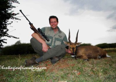 A smiling hunter with a 15-inch Bushbuck Tragelaphus scriptus sylvaticus in the Waterberg Mountains.