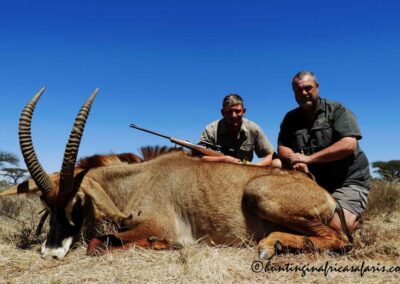 PH Zander posing with a trophy Roan antelope Hippotragus equinus in the North West Province.