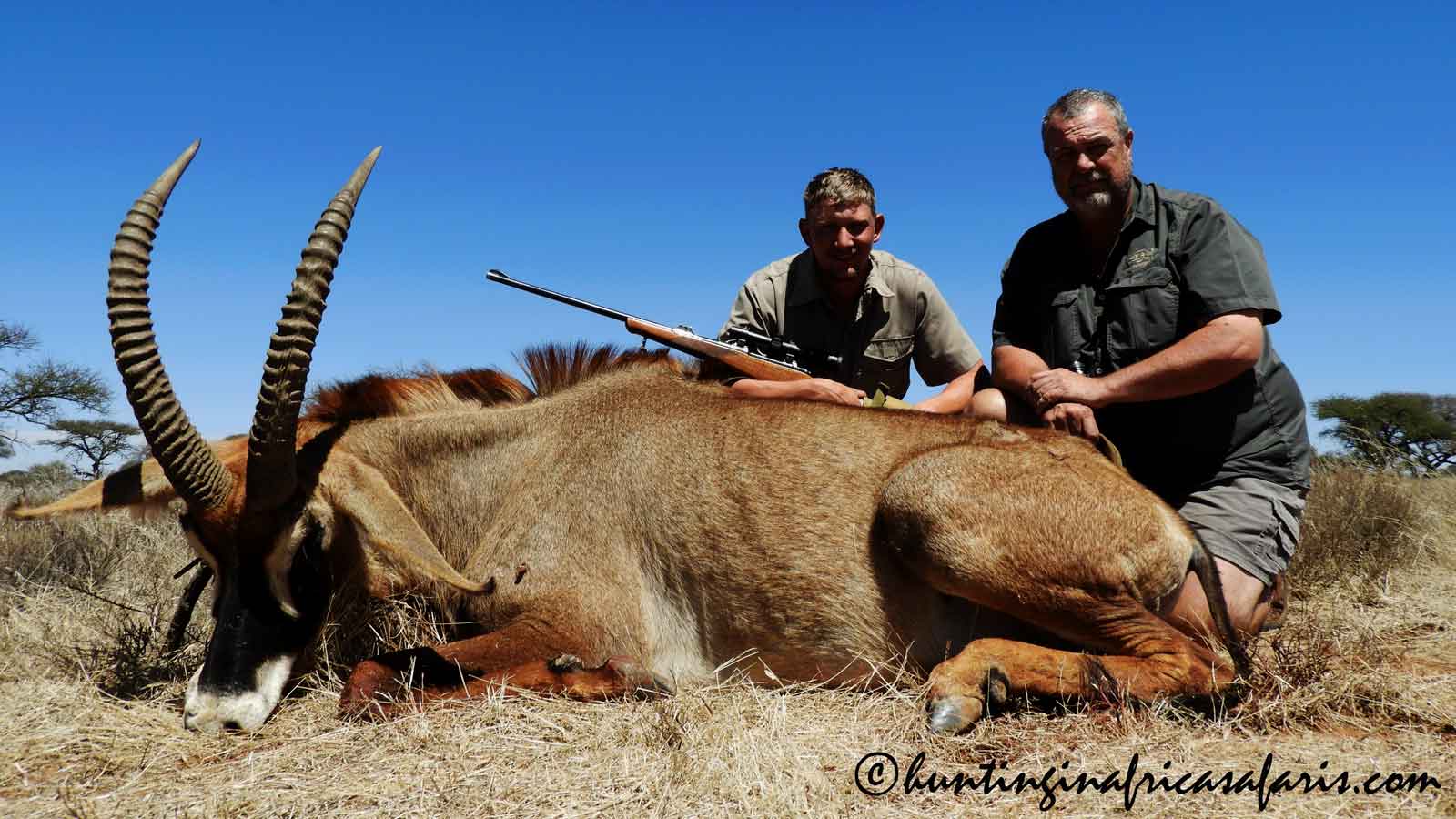 Roan hunting PH Pieter apprentice PH Pieter and an apprentice professional hunter with a trophy roan antelope bull in South Africa.